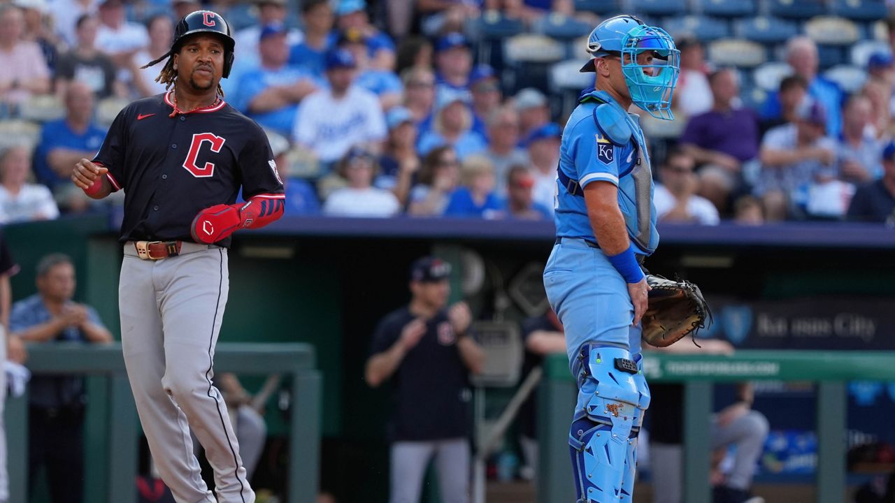 Cleveland Guardians' Steven Kwan (38) congratulates Jose Ramirez, right, after they scored on a single by Kyle Manzardo during the fourth inning of a baseball game against the Baltimore Orioles, Wednesday, July 23, 2025, in Cleveland. (AP Photo/Phil Long)