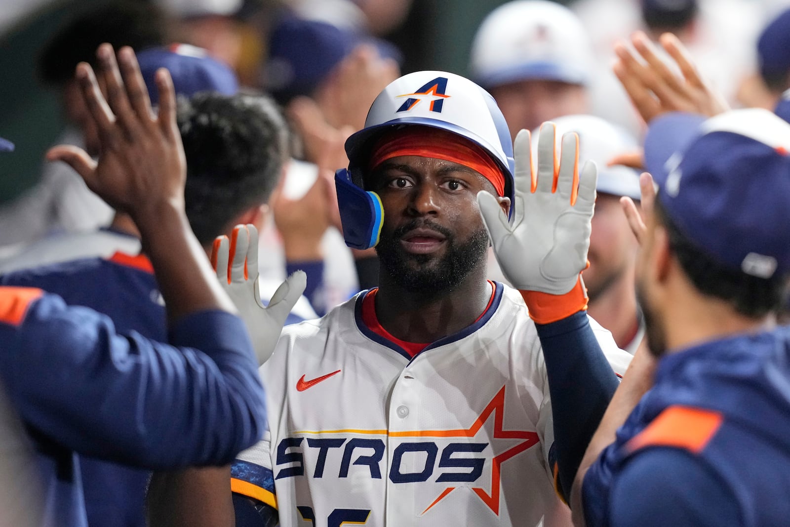 Houston Astros' Taylor Trammell celebrates in the dugout after hitting a three-run home against the Cleveland Guardians during the fifth inning of a baseball game Monday, July 7, 2025, in Houston. (AP Photo/David J. Phillip)