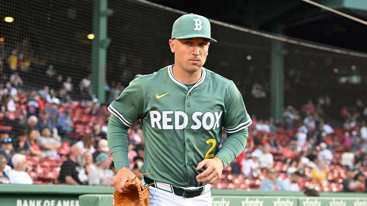 Boston Red Sox third baseman Alex Bregman (2) runs out of the dugout before the start of a game against the Atlanta Braves at Fenway Park.
