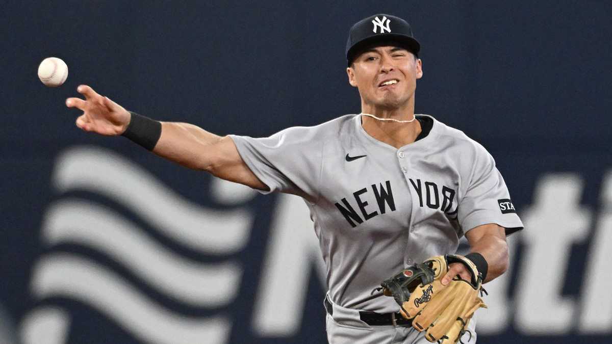 New York Yankees shortstop Anthony Volpe (11) makes a throwing error against the Toronto Blue Jays.