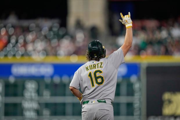 Athletics' Nick Kurtz celebrates after hitting a home run against the Houston Astros during the eighth inning of a baseball game Friday, July 25, 2025, in Houston. (AP Photo/David J. Phillip)