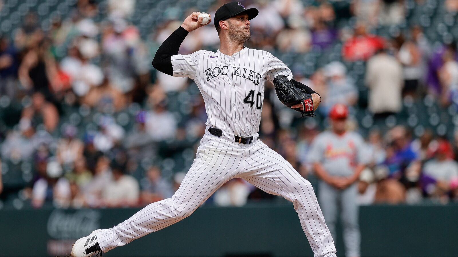 Colorado Rockies relief pitcher Tyler Kinley (40) pitches in the ninth inning against the St. Louis Cardinals at Coors Field.
