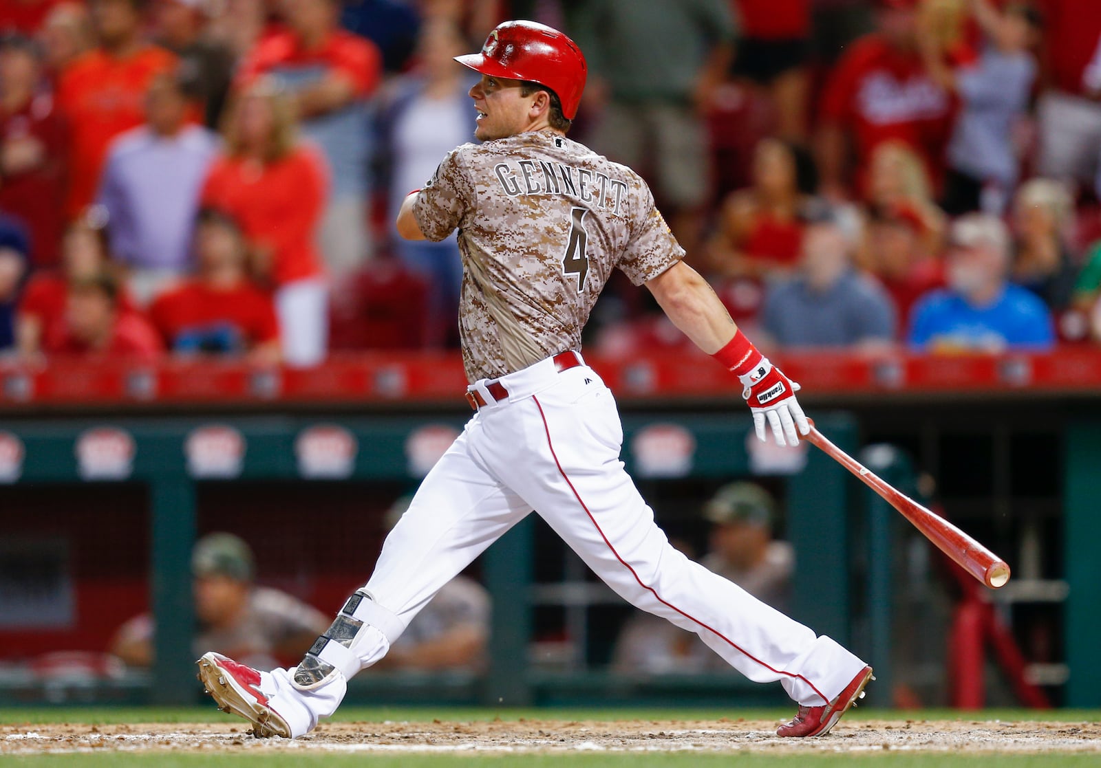 Reds everywhere man Scooter Gennett  watches his fourth home run against the Cardinals at Great American Ball Park on June 6, 2017.