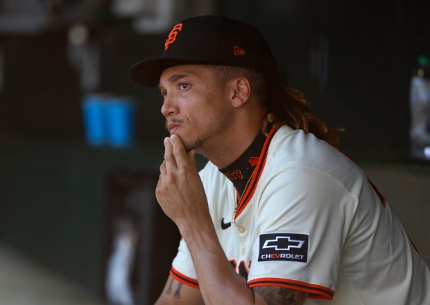 San Francisco Giants’ Spencer Bivens (76) sits in the dugout...