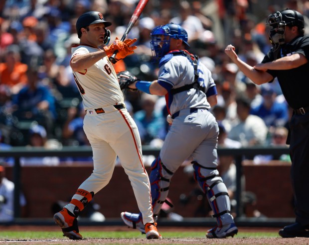 San Francisco Giants’ Casey Schmitt (10) reacts to striking out...
