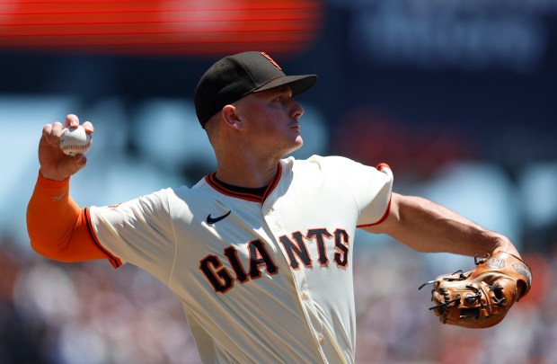 San Francisco Giants’ Matt Chapman (26) throws to first base...