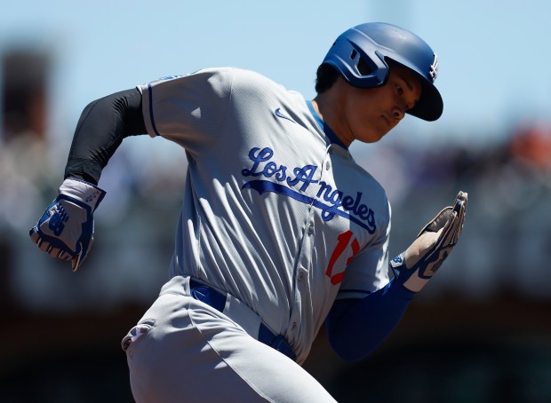 Los Angeles Dodgers’ Shohei Ohtani (17) rounds third base on...