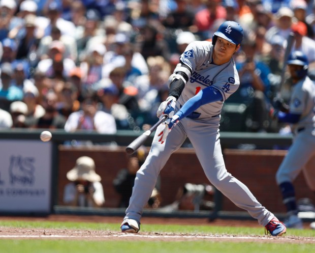 Los Angeles Dodgers' Shohei Ohtani (17) hits a single against the San Francisco Giants in the fifth inning at Oracle Park in San Francisco, Calif., on Sunday, July 13, 2025. (Nhat V. Meyer/Bay Area News Group)