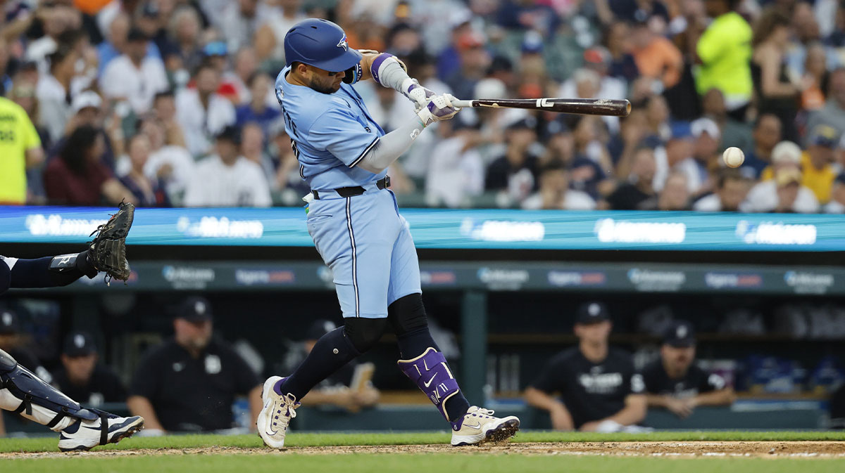 Jul 24, 2025; Detroit, Michigan, USA; Toronto Blue Jays shortstop Bo Bichette (11) hits a single in the seventh inning against the Detroit Tigers at Comerica Park. Mandatory Credit: Rick Osentoski-Imagn Images