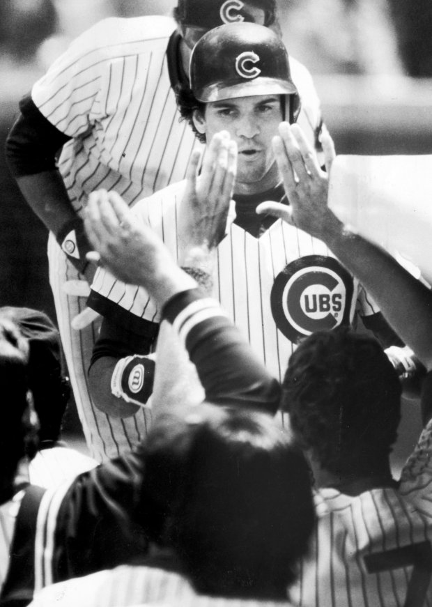 Teammates great Ryne Sandberg after he tripled and scored in the third inning on June 24, 1984. (Jose Moré/Chicago Tribune)