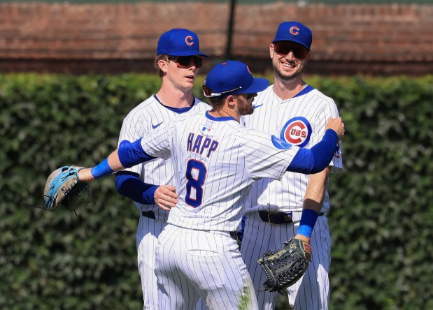 Cubs center fielder Pete Crow-Armstrong, left, left fielder Ian Happ and right fielder Kyle Tucker celebrate a 10-7 win over the Mariners on June 21, 2025, at Wrigley Field. (John J. Kim/Chicago Tribune)