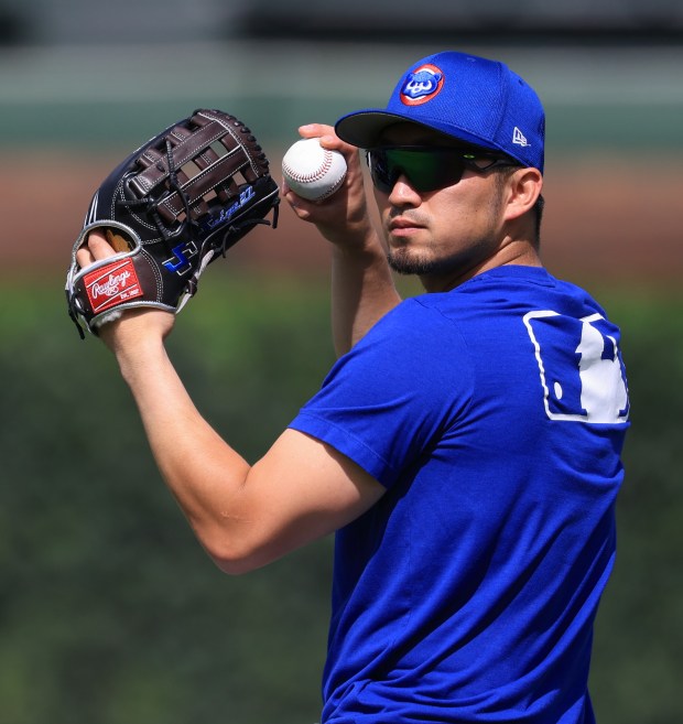 Cubs designated hitter Seiya Suzuki warms up for a game against the Red Sox on July 19, 2025, at Wrigley Field. (John J. Kim/Chicago Tribune)