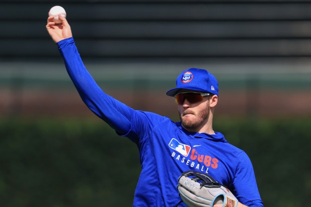 Cubs left fielder Ian Happ warms up for a game against the Red Sox on July 19, 2025, at Wrigley Field. (John J. Kim/Chicago Tribune)