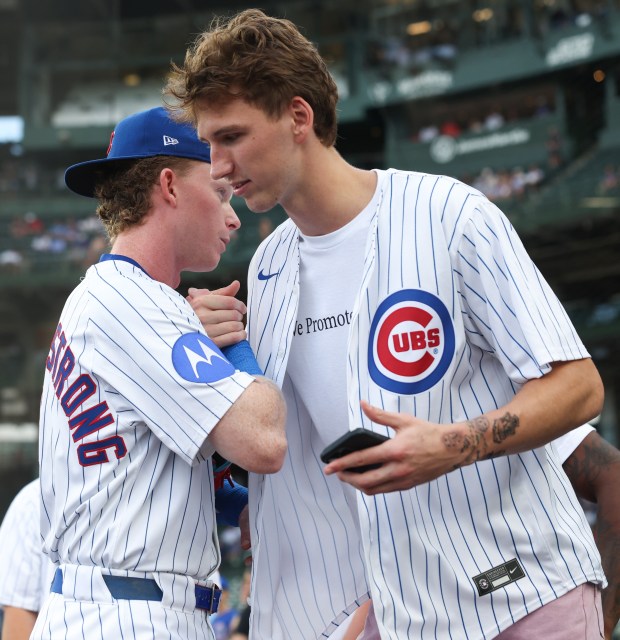 Cubs center fielder Pete Crow-Armstrong and Bulls forward Matas Buzelis greet each other before a Cubs-Red Sox game on July 19, 2025, at Wrigley Field. (John J. Kim/Chicago Tribune)