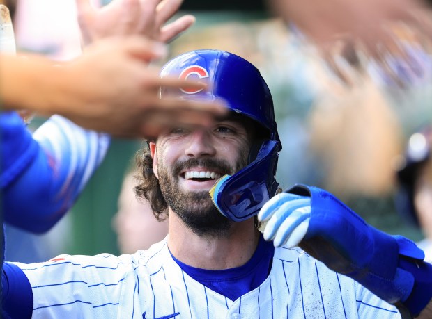 Cubs shortstop Dansby Swanson celebrates after scoring on a sacrifice fly in the second inning against the Red Sox on July 19, 2025, at Wrigley Field. (John J. Kim/Chicago Tribune)