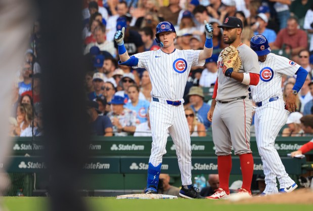 Cubs center fielder Pete Crow-Armstrong gestures to teammates after hitting a single against the Red Sox in the third inning on July 19, 2025, at Wrigley Field. (John J. Kim/Chicago Tribune)