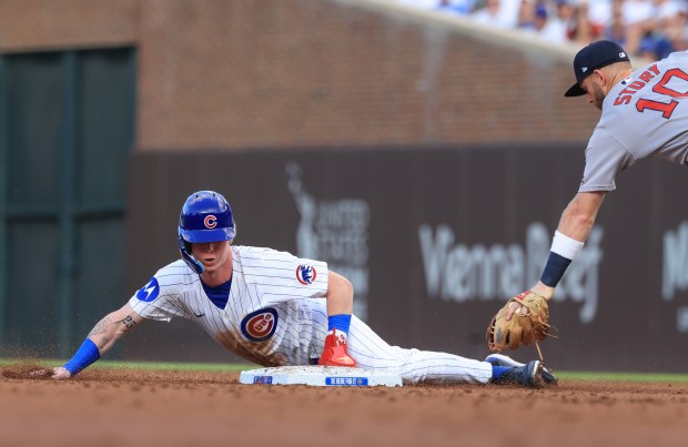 Cubs center fielder Pete Crow-Armstrong beats the tag from Red Sox shortstop Trevor Story to steal second base in the third inning on July 19, 2025, at Wrigley Field. (John J. Kim/Chicago Tribune)