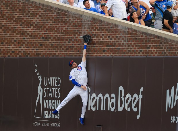 Cubs right fielder Kyle Tucker leaps for an out-of-reach foul ball in the fourth inning against the Red Sox on July 19, 2025, at Wrigley Field. (John J. Kim/Chicago Tribune)