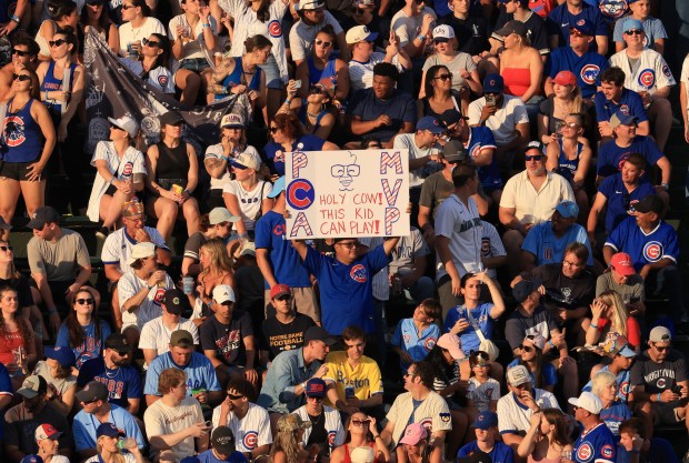 A Cubs fan holds a sign celebrating center fielder Pete Crow-Armstrong in the fourth inning against the Red Sox on July 19, 2025, at Wrigley Field. (John J. Kim/Chicago Tribune)