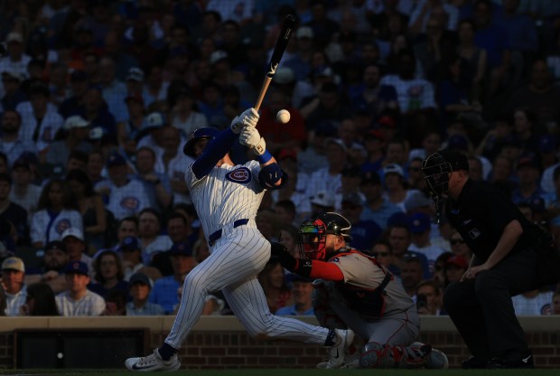 Cubs second baseman Nico Hoerner fouls off a pitch in the fourth inning against the Red Sox on July 19, 2025, at Wrigley Field. (John J. Kim/Chicago Tribune)