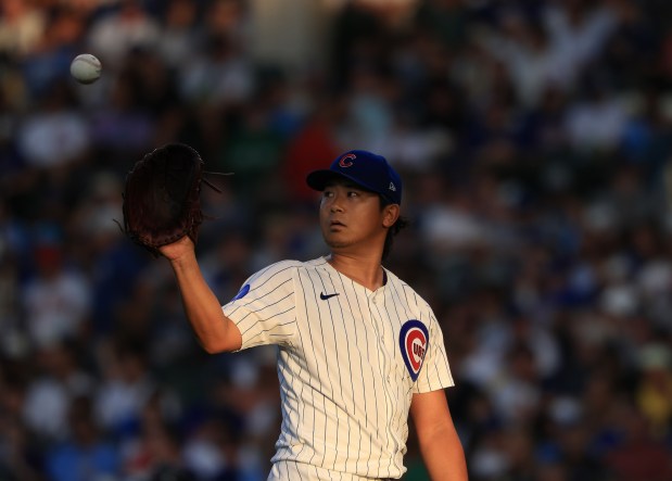 Cubs starter Shota Imanaga retrieves a ball between batters in the fifth inning against the Red Sox on July 19, 2025, at Wrigley Field. (John J. Kim/Chicago Tribune)