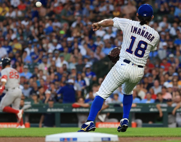 Cubs startier Shota Imanaga throws to first on an infield single by Red Sox first baseman Abraham Toro in the seventh inning on July 19, 2025, at Wrigley Field. (John J. Kim/Chicago Tribune)