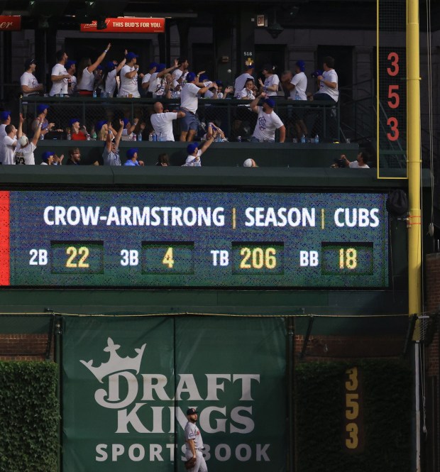 A home run ball hit by Cubs center fielder Pete Crow-Armstrong flies past fans in right field in the eighth inning against the Red Sox on July 19, 2025, at Wrigley Field. (John J. Kim/Chicago Tribune)