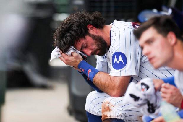 Chicago Cubs shortstop Dansby Swanson wipes his face with a towel during the fifth inning against the Kansas City Royals at Wrigley Field, July 23, 2025. (Eileen T. Meslar/Chicago Tribune)