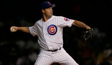 Cubs pitcher Greg Maddux records his 3,000th strikeout at a wet Wrigley Field