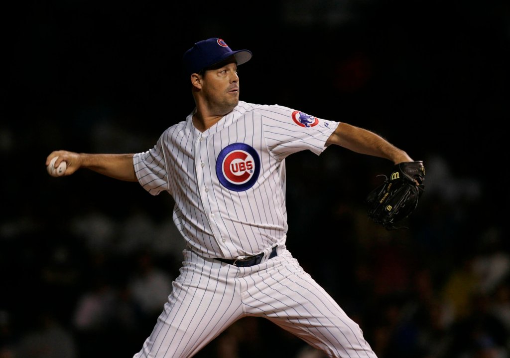 Cubs pitcher Greg Maddux records his 3,000th strikeout at a wet Wrigley Field