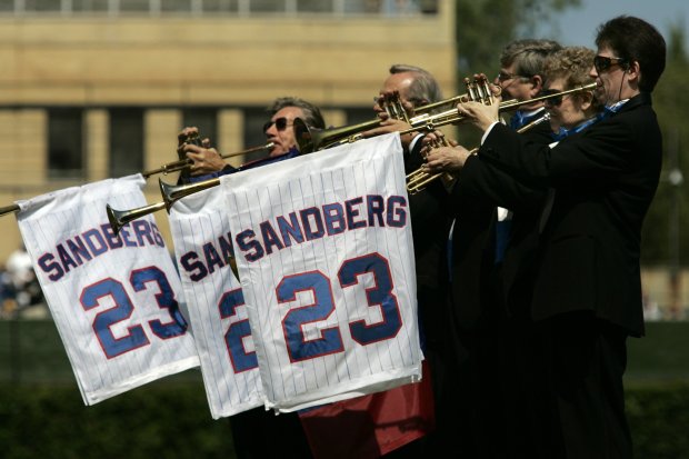 Trumpets play as former Chicago Cubs second baseman and Hall of Fame player Ryne Sandberg is introduced as his No. 23 jersey is retired before a game against the Florida Marlins at Wrigley Field in Chicago, on Aug. 28, 2005. (José M. Osorio/Chicago Tribune)