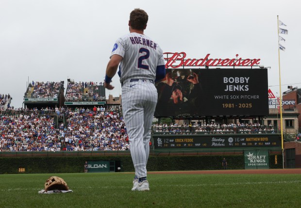 A moment of silence is held for former White Sox pitcher Bobby Jenks before a Cubs-Cardinals game at Wrigley Field on July 6, 2025, in Chicago. (John J. Kim/Chicago Tribune)