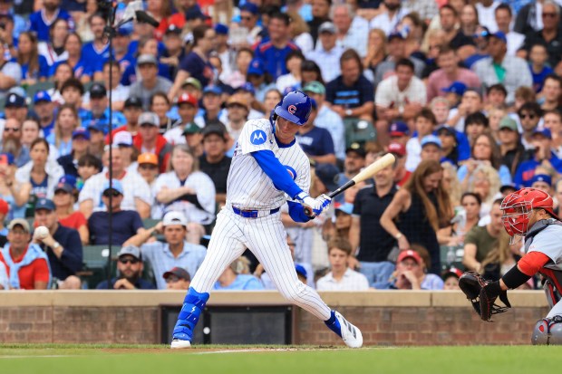 Cubs center fielder Pete Crow-Armstrong swings for an RBI single against the Cardinals in the first inning at Wrigley Field on July 6, 2025, in Chicago. (John J. Kim/Chicago Tribune)