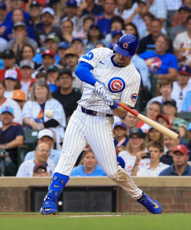 Cubs left fielder Kyle Tucker swings for a two-run single in the second inning against the Cardinals at Wrigley Field on July 6, 2025, in Chicago. (John J. Kim/Chicago Tribune)