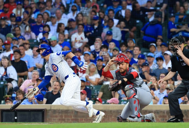 Cubs third baseman Matt Shaw hits into a fielder's choice, resulting in a run scored on a throwing error by the Cardinals, in the third inning at Wrigley Field on July 6, 2025, in Chicago. (John J. Kim/Chicago Tribune)