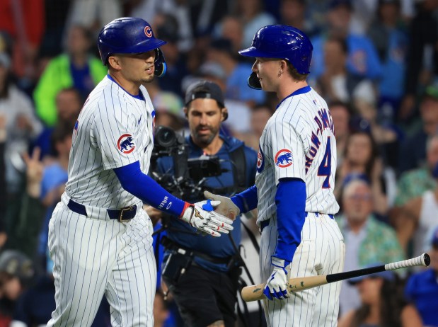 Cubs designated hitter Seiya Suzuki, left, is congratulated by center fielder Pete Crow-Armstrong after hitting a home run in the fifth inning against the Cardinals at Wrigley Field on July 6, 2025, in Chicago. (John J. Kim/Chicago Tribune)