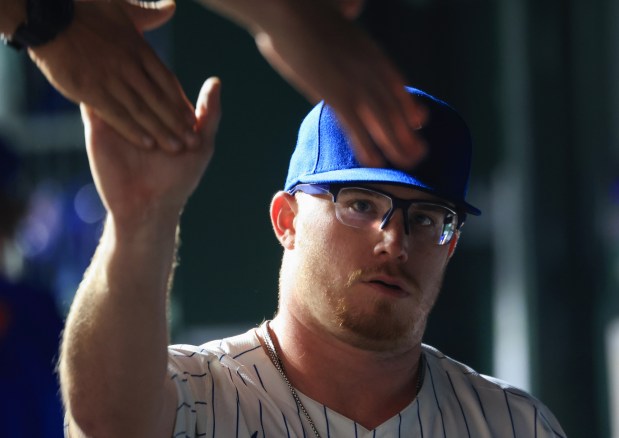 Cubs pitcher Jordan Wicks is congratulated after being taken out of the game in the ninth inning against the Cardinals at Wrigley Field on July 6, 2025, in Chicago. (John J. Kim/Chicago Tribune)