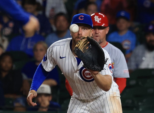 Cubs first baseman Michael Busch catches the throw for an out in the ninth inning against the Cardinals at Wrigley Field on July 6, 2025, in Chicago. (John J. Kim/Chicago Tribune)