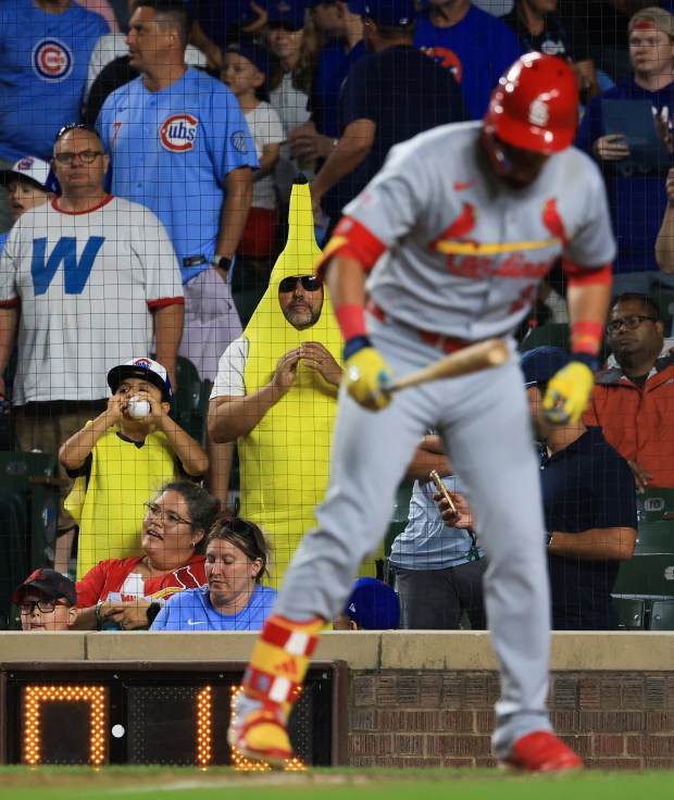 Two Cubs fans dressed in banana costumes watch the ninth inning of a Cubs-Cardinals game at Wrigley Field on July 6, 2025, in Chicago. (John J. Kim/Chicago Tribune)
