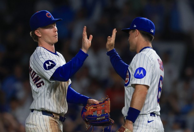 Cubs center fielder Pete Crow-Armstrong, left, and third baseman Matt Shaw celebrate an 11-0 win over the Cardinals at Wrigley Field on July 6, 2025, in Chicago. (John J. Kim/Chicago Tribune)