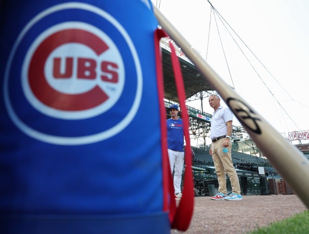 Cubs manager Craig Counsell, left, and President of Baseball Operations Jed Hoyer talk before a game against the Guardians at Wrigley Field on July 3, 2025, in Chicago. (John J. Kim/Chicago Tribune)