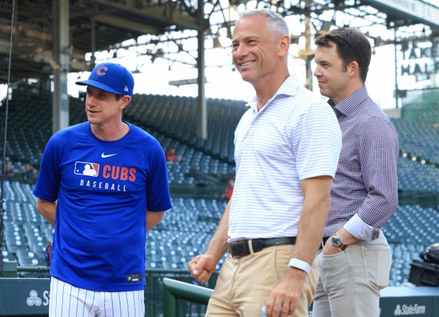 Cubs manager Craig Counsell, from left, President of Baseball Operations Jed Hoyer and general manager Carter Hawkins talk before a game against the Guardians at Wrigley Field on July 3, 2025, in Chicago. (John J. Kim/Chicago Tribune)