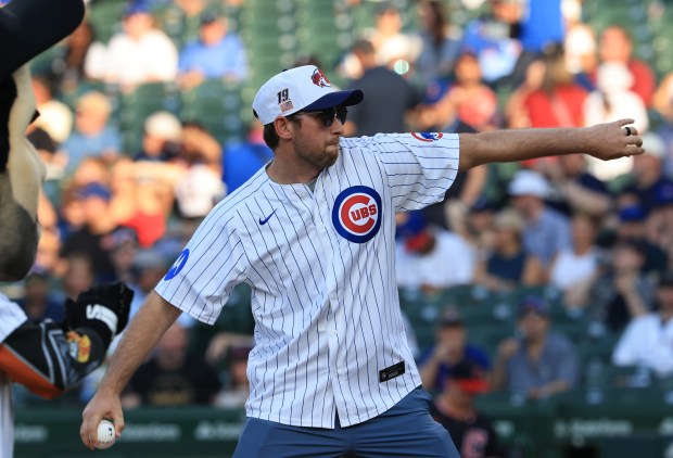 NASCAR driver Chase Briscoe throws a ceremonial first pitch before a Cubs-Guardians game at Wrigley Field on July 3, 2025, in Chicago. (John J. Kim/Chicago Tribune)