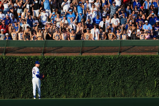 Fans of Cubs center fielder Pete Crow-Armstrong wear body paint spelling out his name before a game against the Guardians at Wrigley Field on July 3, 2025, in Chicago. (John J. Kim/Chicago Tribune)