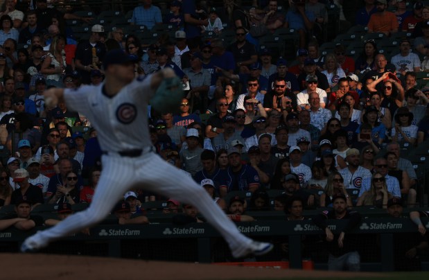 A sliver of sunlight shines on fans as Cubs starting pitcher Cade Horton throws against the Guardians in the first inning at Wrigley Field on July 3, 2025, in Chicago. (John J. Kim/Chicago Tribune)