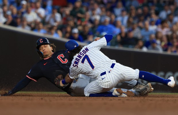 Cubs shortstop Dansby Swanson tags out Guardians catcher Bo Naylor on a steal attempt in the fifth inning at Wrigley Field on July 3, 2025, in Chicago. (John J. Kim/Chicago Tribune)