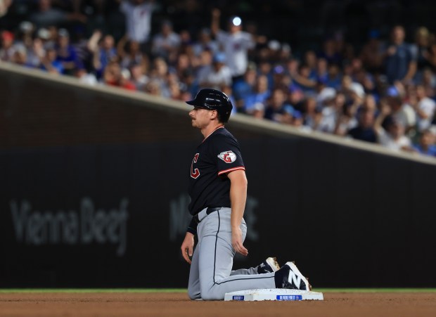 Guardians designated hitter Kyle Manzardo kneels next to second base after getting tagged out on a runner's fielder's choice in the sixth inning against the Cubs at Wrigley Field on July 3, 2025, in Chicago. (John J. Kim/Chicago Tribune)