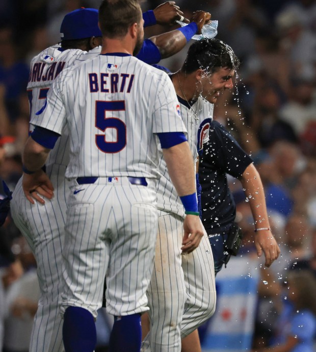 Cubs third baseman Matt Shaw, right, is congratulated after hitting a game-winning RBI sacrifice fly ball for a 1-0 win over the Guardians in ten innings at Wrigley Field on July 3, 2025, in Chicago. (John J. Kim/Chicago Tribune)