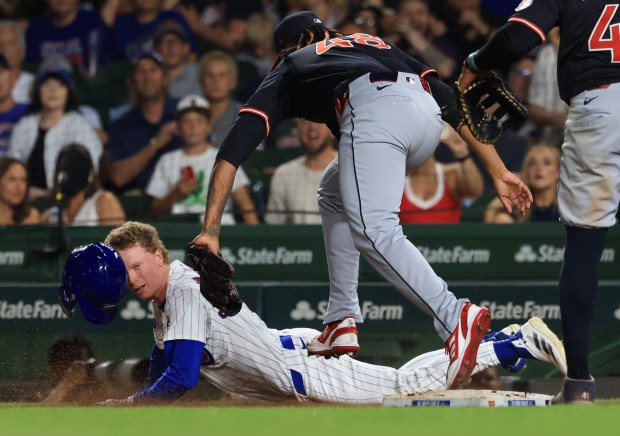 Cubs center fielder Pete Crow-Armstrong dives past first base on a groundout in the ninth inning against the Guardians at Wrigley Field on July 3, 2025, in Chicago. (John J. Kim/Chicago Tribune)