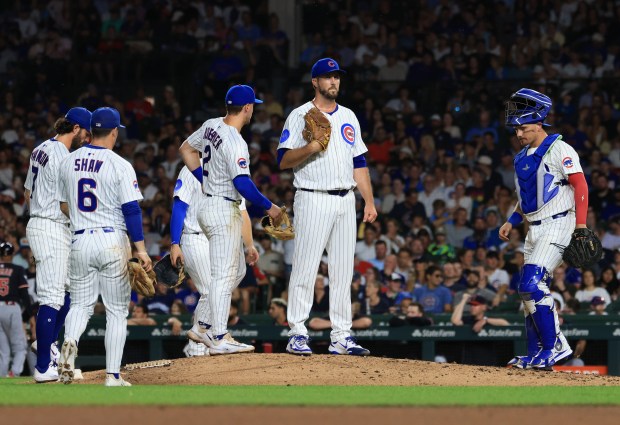 Cubs pitcher Drew Pomeranz, center, waits on the mound before being taken out of the game in the eighth inning against the Guardians at Wrigley Field on July 3, 2025, in Chicago. (John J. Kim/Chicago Tribune)